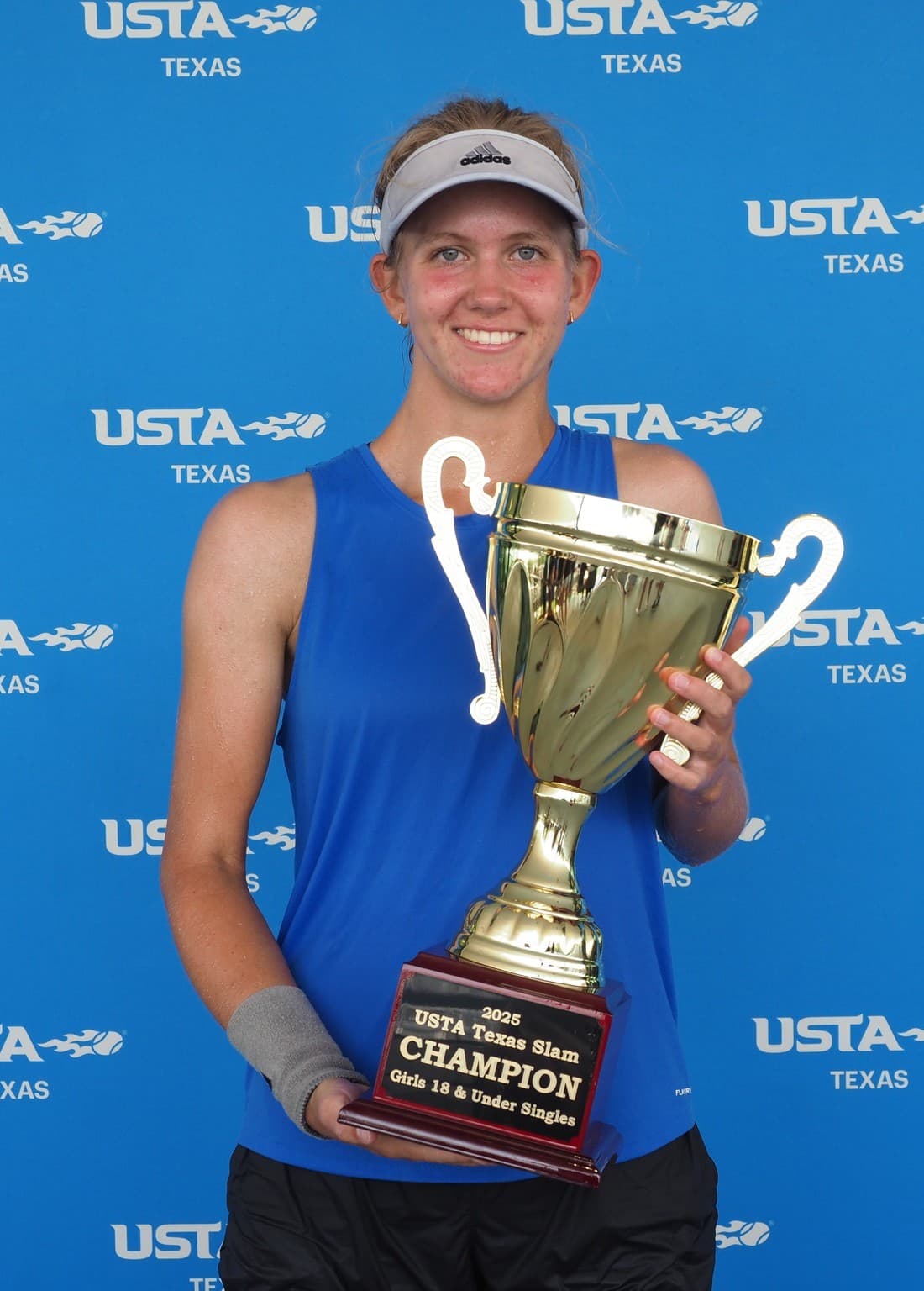 A champion on court at the Texas Slam, High Point Tennis Center.
