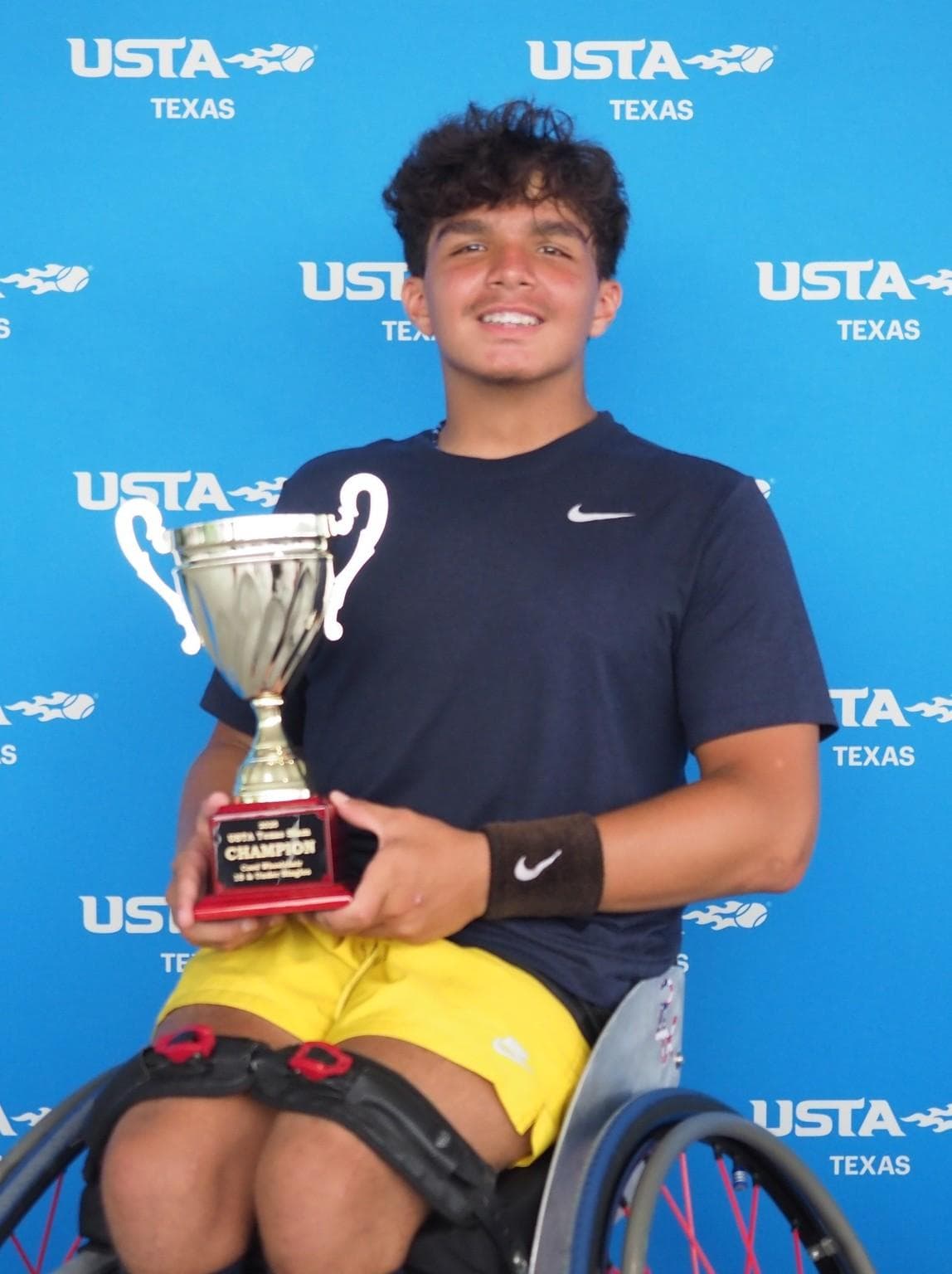 A wheelchair tennis champion competing at the Texas Slam.